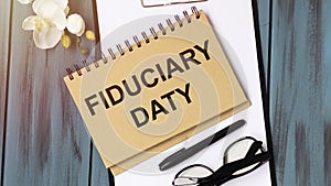 Notebook written with FIDUCIARY DATY word