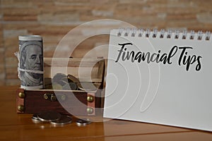 Notebook written with text FINANCIAL TIPS