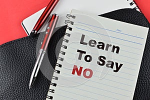 Notebook written with text LEARN TO SAY NO