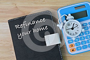 Notebook written with text REFINANCE YOUR HOME