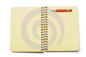 Notebook yellow paper and red pencil