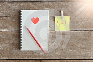 Notebooks, clip boards, Notepad, pencil Arranged in is the meaning I Love You