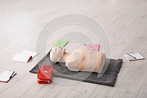 Notebooks, first aid mannequin and bag