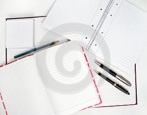 Notebooks and pens photo