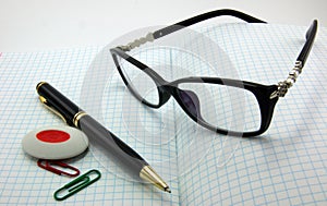 Notebooks, pens, glasses