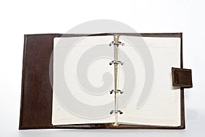 Notebookwith leather cover, notepad on white background with space for text