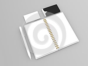 Notepad, business cards and pen on a gray background.