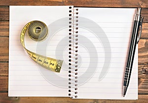 Notepad with centimeter and pen