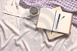 Notepad is a cup of coffee and a book with beige toning. Diary Lifestyle Plaid Scarf Lavender Toning