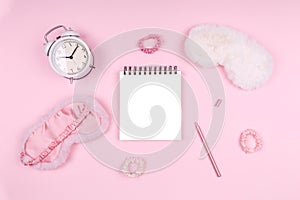 Notepad with cute fluffy sleep masks and pink accessories