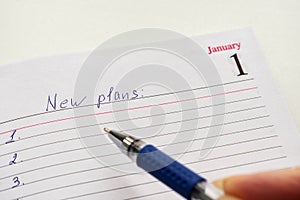 Notepad with the date of 1 January. The concept of recording plans for the new year