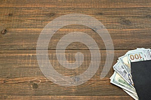 Notepad With Dollar Cash On The Brown Wood Background