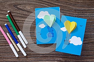 Notepad for entries of handmade balloons and markers decorated with appliquÃ©s, paper on a desk, craft of paper.
