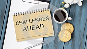 Notepad with hot topic Challenges Ahead lying