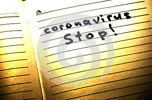 Notepad with the inscription - coronavirus Stop, covid 19 Stop