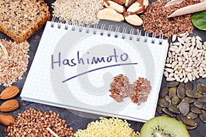 Notepad with inscription hashimoto and best ingredients for healthy thyroid
