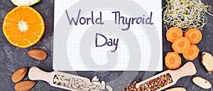 Notepad with inscription World Thyroid Day and best food containing vitamins for healthy thyroid