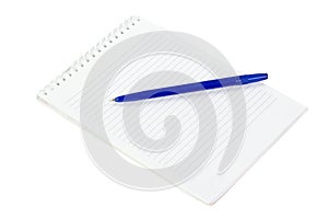 The notepad and lying on a blue pen isolated on white