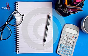 Notepad with office supplies