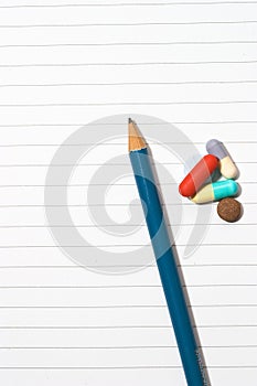 Notepad, one pencil, pills