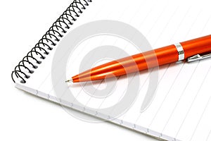 Notepad with orange ball pen