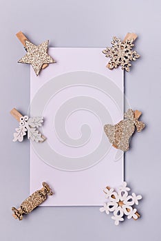 Notepad Page and Small Christmas Decorations on Blue Background New Year`s Decor Christmas wishlist MockUp Vertical