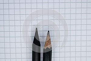 Notepad page with two pencils closeup - Image