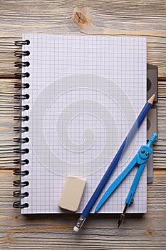 Notepad, pencil, caliper and eraser
