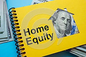 Notepad with sign home equity and cash.