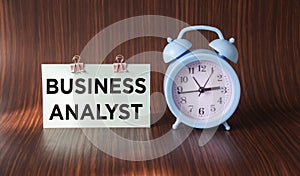 On the notepad text BUSINESS ANALYST. Concept of business, technology, internet and networks