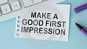Notepad with text MAKE A GOOD FIRST IMPRESSION . White background. Business concept