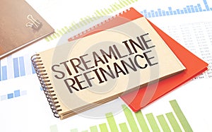 Notepad with text streamline refinance. Diagram, red notepad and white background