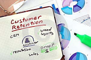 Notepad with words customer retention strategies. photo