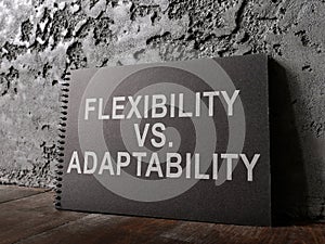A Notepad with words flexibility vs adaptability. photo