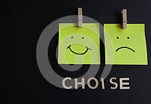 Notepads with a smiling face and a sad face, respectively, with the phrase " Choice "