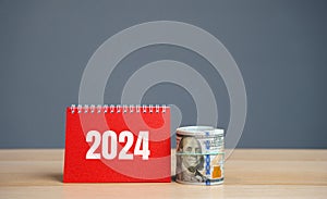 Notes 2024 and dollar bills. Budget planning concept. Financial goals and plans. Business and finance. Forecasting and analysis.