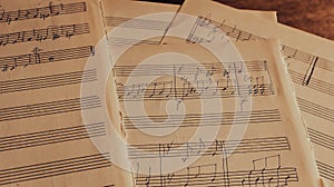 Notes on paper. Old music sheet. Melody on page. Notes and lines. Music concept. Rhythm on vintage blank. Sound symbols and signs