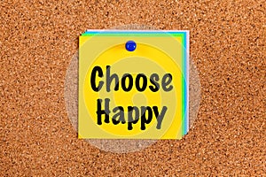 Notes with words Choose Happy on corkboard