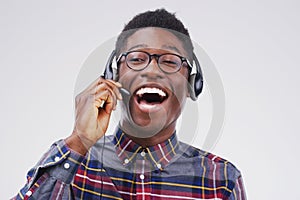 Nothing builds positive customer relations like a positive agent. Studio shot of a handsome young male customer service