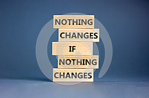 Nothing change symbol. Concept words Nothing changes if nothing changes on wooden blocks. Beautiful grey table grey background.