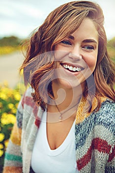 Nothing feels as good as a beautiful spring day. an attractive young woman enjoying a spring day outdoors.