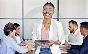 Nothing stopped her hustle. Shot of a young businesswoman in the middle of a meeting.