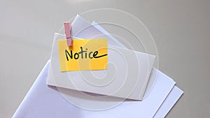 Notice message concept written post it on envelope.