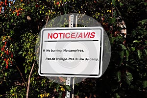 A notice no burning no campfires sign