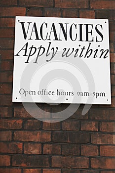 Notice Offering Job Vacancies On Brick Wall