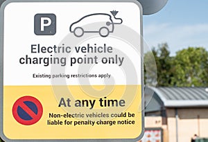 Notice warning of parking restrictions for non electric vehicles parking in an electric vehicle charging bay