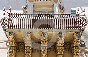 NOTO, ITALY - Detail of Baroque Balcony, 1750 photo