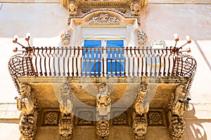 NOTO, ITALY - Detail of Baroque Balcony, 1750 photo