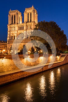 Notre Dame Cathedral illuminated at twilight. Summer in Paris, France