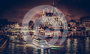 Notre Dame cathedral and river at night